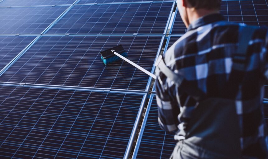 man-worker-firld-by-solar-panels (1)